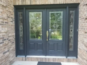 Newly installed black front doors.